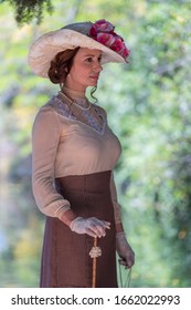 Elegant Lady, From High Society Of The Twentieth Century, Walking Through A Public Park
