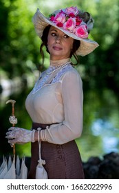 Elegant Lady, From High Society Of The Twentieth Century, Walking Through A Public Park
