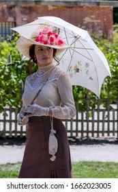 Elegant Lady, From High Society Of The Twentieth Century, Walking Through A Public Park
