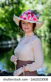 Elegant Lady, From High Society Of The Twentieth Century, Walking Through A Public Park
