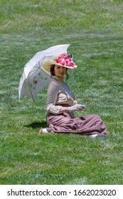 Elegant Lady, From High Society Of The Twentieth Century, Walking Through A Public Park
