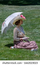 Elegant Lady, From High Society Of The Twentieth Century, Walking Through A Public Park
