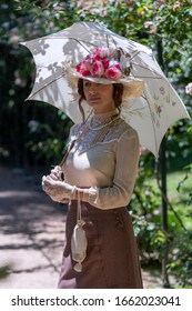 Elegant Lady, From High Society Of The Twentieth Century, Walking Through A Public Park
