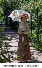 Elegant Lady, From High Society Of The Twentieth Century, Walking Through A Public Park
