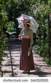 Elegant Lady, From High Society Of The Twentieth Century, Walking Through A Public Park
