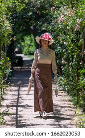 Elegant Lady, From High Society Of The Twentieth Century, Walking Through A Public Park
