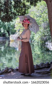 Elegant Lady, From High Society Of The Twentieth Century, Walking Through A Public Park
