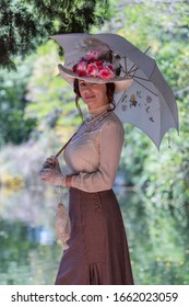 Elegant Lady, From High Society Of The Twentieth Century, Walking Through A Public Park
