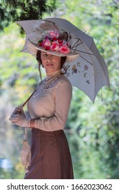 Elegant Lady, From High Society Of The Twentieth Century, Walking Through A Public Park
