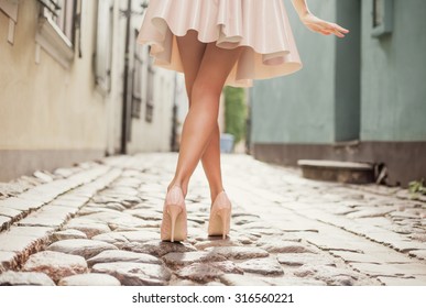 Elegant Lady Walking Alone In The Street