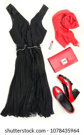 Elegant Little Women's Black Dress And Red Accessories For Special Date Or Holiday. Cocktail Dress Outfit, Night Outlook On White Background. Little Black Dress, Red Clutch, Shoes And Shawl. Flat Lay.