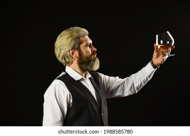 Elegant Macho Drink Cognac. Matured In Sherry Casks. Whisky Tasting. Good Indication Of Condition Of Whisky. Bearded Businessman In Elegant Suit With Glass Of Whisky. Sommelier Tastes Expensive Drink