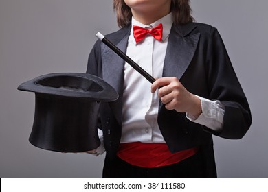 Elegant Magician Holding Magic Hat And Wand - Closeup