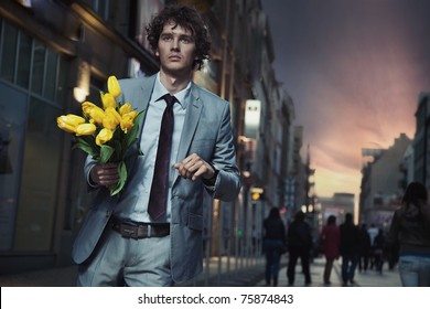 Elegant Man Holding Flowers