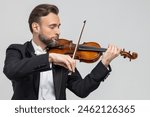 Elegant man skilled musician playing violin
