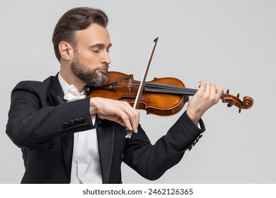 Elegant man skilled musician playing violin - Powered by Shutterstock