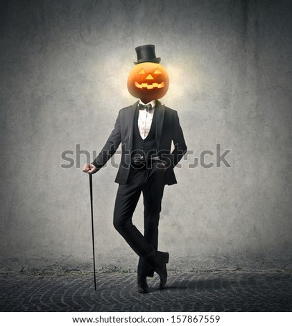 elegant man wearing suit and cylinder for the Halloween party