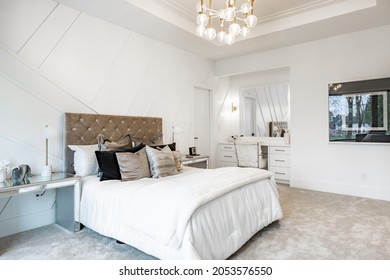 Elegant Master Bedroom And Bathroom With White Furnishings Glass Shower Make Up Counter And Pillows