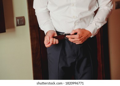 Elegant And Mature Man Getting Dressed