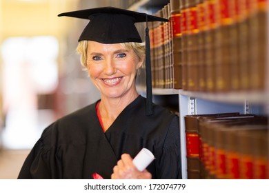 Elegant Middle Aged Female Law School Graduate In Library