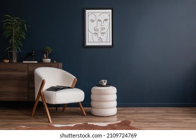 Elegant modern living room interior design with fluffy armchair, pouf, wooden commode, mock up poster frame and modern home accessories. Blue wall. Template. Copy space. - Shutterstock ID 2109724769