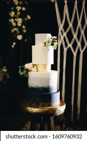 Elegant Modern Wedding Cake With Golden Coating And Flowers