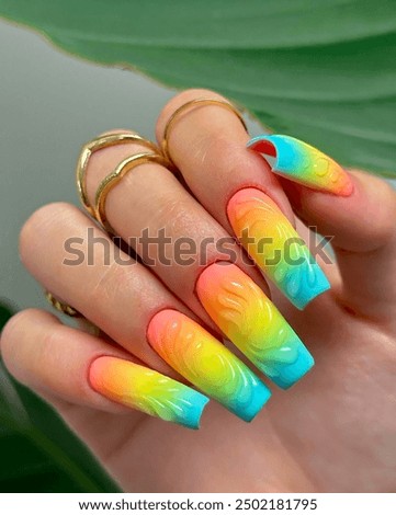 Elegant and more artistic Nail art design in young women's hand. Fruit and flowers designs on nails