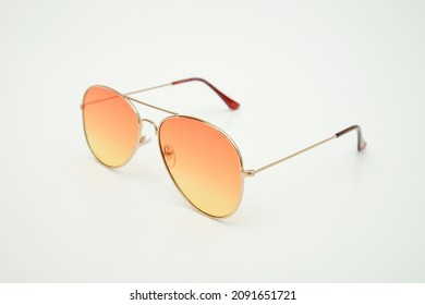 Elegant Orange Glasses Side View On White Background