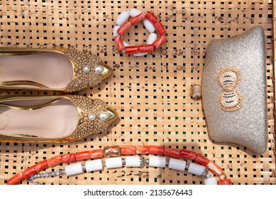 The elegant ornaments of an Igbo bride on her traditional wedding day. From the beads and shoes and purse..