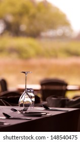 Elegant Outdoor Restaurant Setting With Empty Glasses On The Table