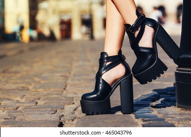 Elegant Outfit. Closeup Of Stylish Black Leather Summer Shoes. Fashionable Girl Posing On  Street Of The Old City. Female Fashion Concept. Copy Space For Text. Toned