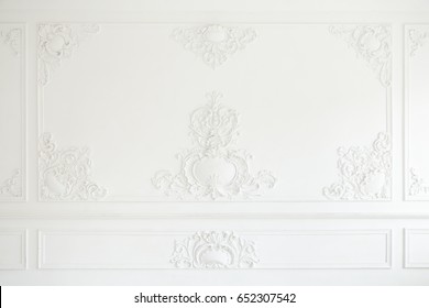 An Elegant Panel On A White Wall Made Using Stucco Moldings