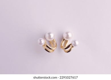 Elegant pearl earrings isolated on white, top view - Shutterstock ID 2291027617
