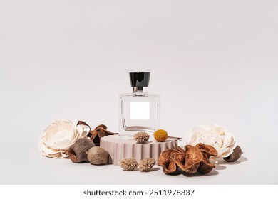 Elegant Perfume Bottle with Natural Floral Arrangement on Pedestal - Minimalist Beauty Concept. Perfect for Perfumery Themes and Scent Presentations. - Powered by Shutterstock