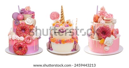 Elegant pink layered cakes for a girl or a woman. Isolated on white background with copy space for text. Decorated with donuts and unicorn