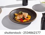 Elegant Plating of Sea Bass Fillet with Sweet Potato Puree and Vegetables in Modern Photography.