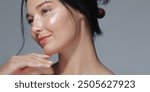 Elegant portrait of an Asian woman with glowing skin and natural makeup. Perfect for beauty, skincare, and cosmetics promotions, showcasing high-quality and natural beauty concepts. 