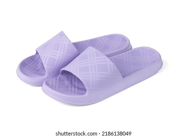 Elegant purple rubber flip-flops insulated on a white background. The concept of summer women's shoes.