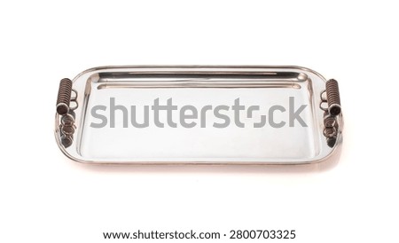 elegant rectangular tray in silver metal features distinctive handles decorated with spiral details.