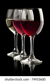 Elegant Red, Rose And White Wine Glasses In A Black Background