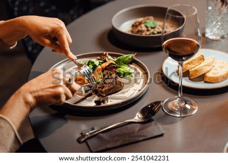 Similar – Image, Stock Photo Close up shot of dark skinned female has satisfied expression, bushy curly hair, wears spectacles and white jumper, looks straightly at camera, models over grey background. Natural beauty concept