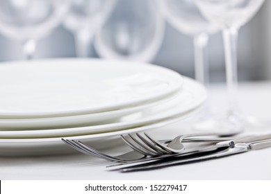 Elegant Restaurant Table Setting For Fine Dining With Plates Cutlery And Stemware