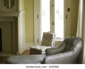 Elegant Room Section With Chase Lounge And Pillow Chair