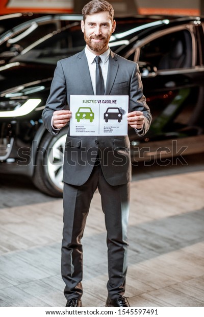 Elegant sales consultant showing a drawing on\
the topic of eco-friendly electric cars, selling vehicles at the\
car dealership