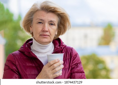 Elegant Senior Adult Woman Outdoors With Coffee, In The Wind, With Developing Hair