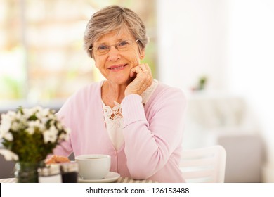 Elegant Senior Woman Having Tea