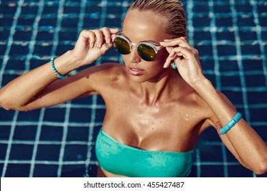 Elegant Sexy Woman Posing Near In A Swimming Pool