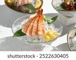 Elegant Shrimp Sashimi on Ice with Fresh Garnishes and Bright Lighting.