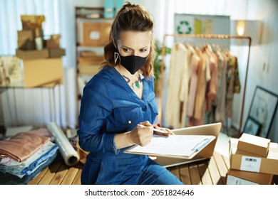 Elegant Small Business Owner Woman With Black Mask In The Office.