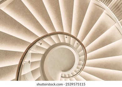 Elegant spiral staircase with warm lighting, showcasing intricate design and symmetry. A modern architectural feature with a captivating, timeless aesthetic                - Powered by Shutterstock